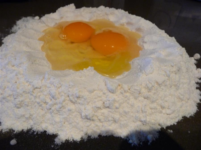 Flour well with two eggs