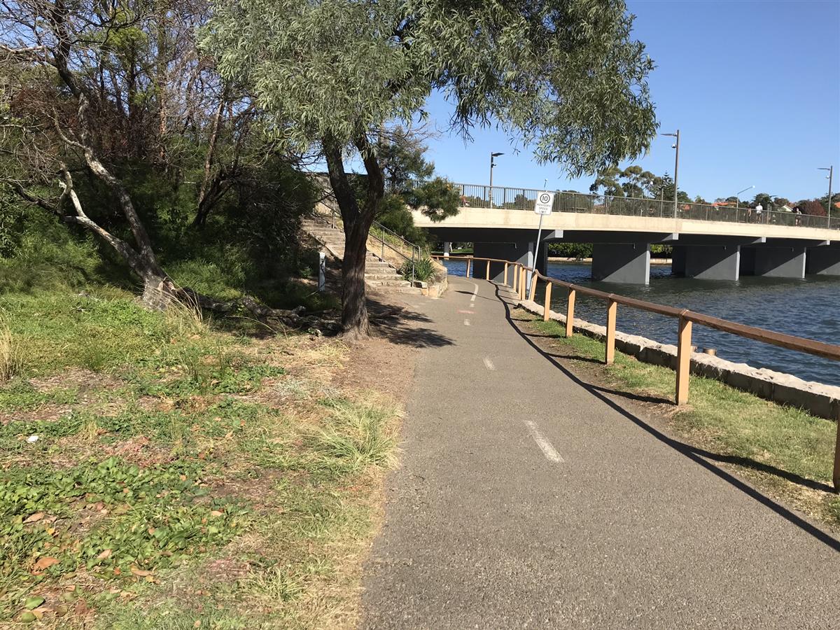 Track leading to pedestrian and bike bridge